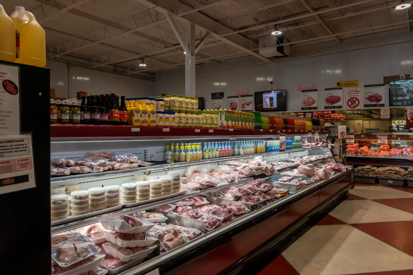 Refrigerated meat cases and a red and white checkered floor at the LaSalle store
